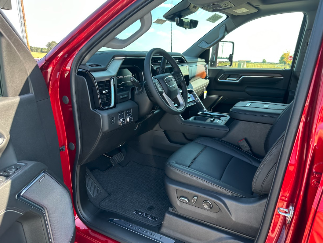 Interior view of a red GMC Denali truck at Crain Buick GMC in Springdale